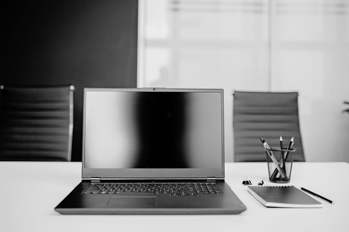 Laptop displaying a clean website layout in a bright office